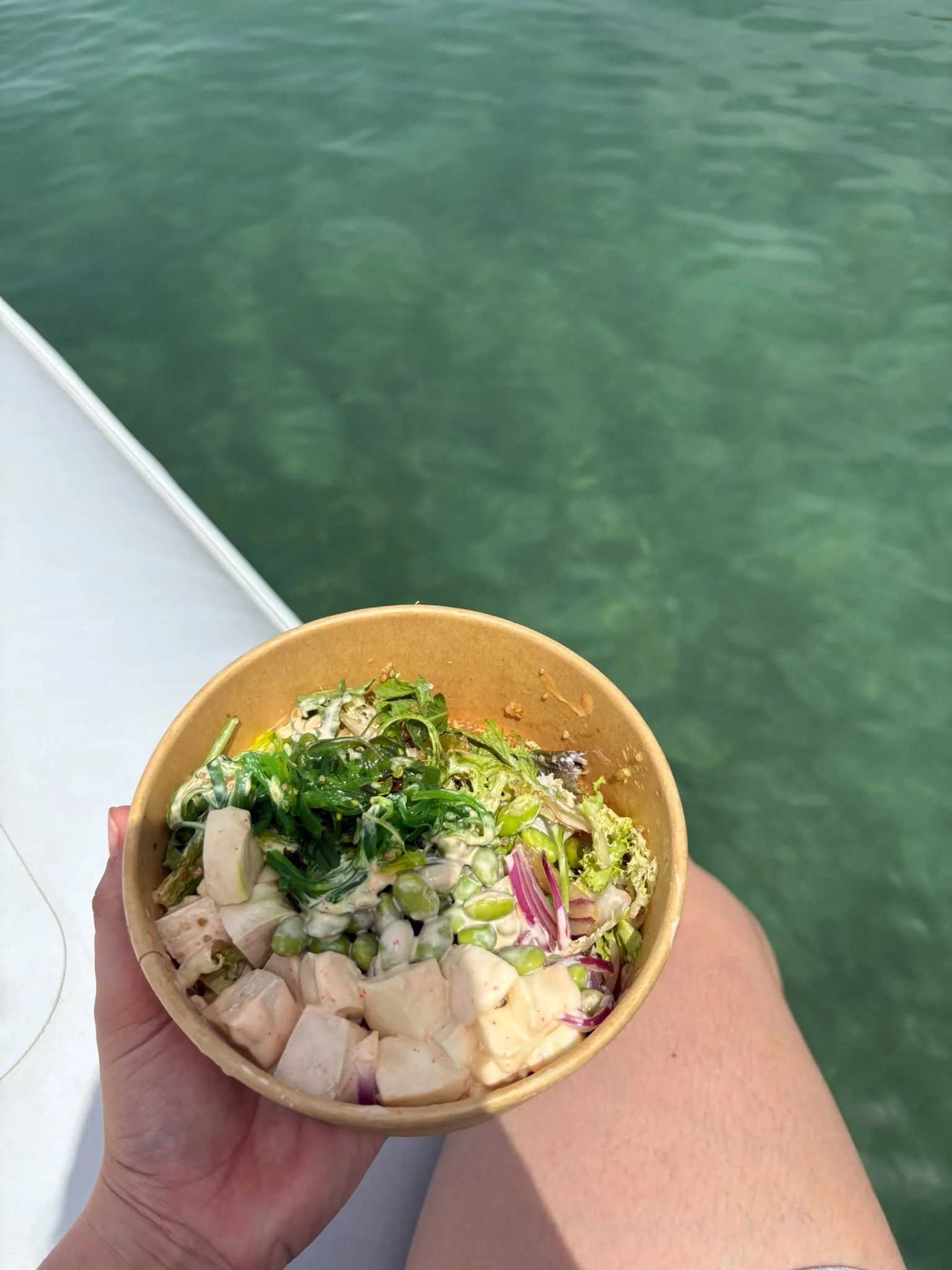 Fresh poke bowl from Pinsi's Picnic enjoyed on a boat
