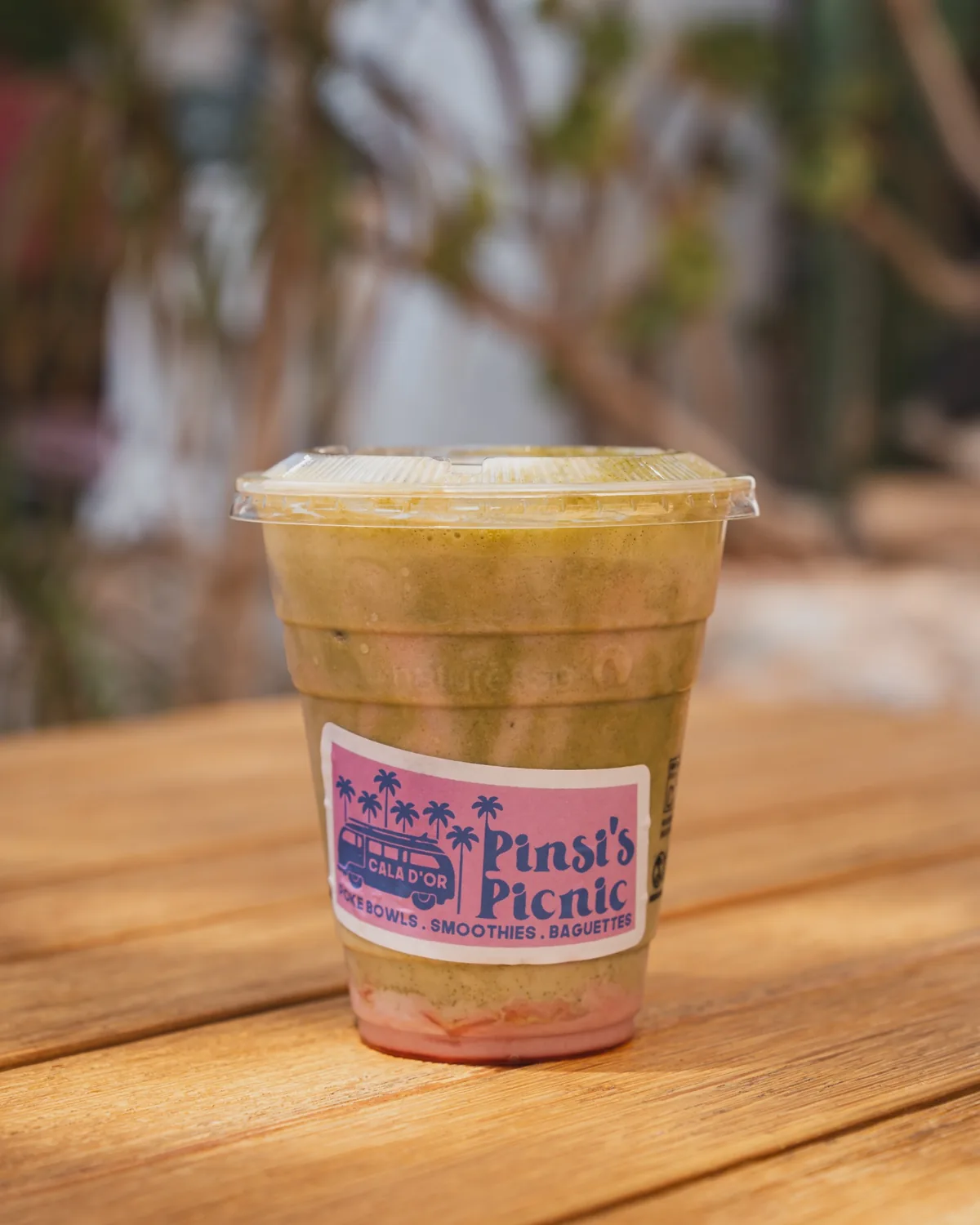 Natural green smoothie served on the terrace