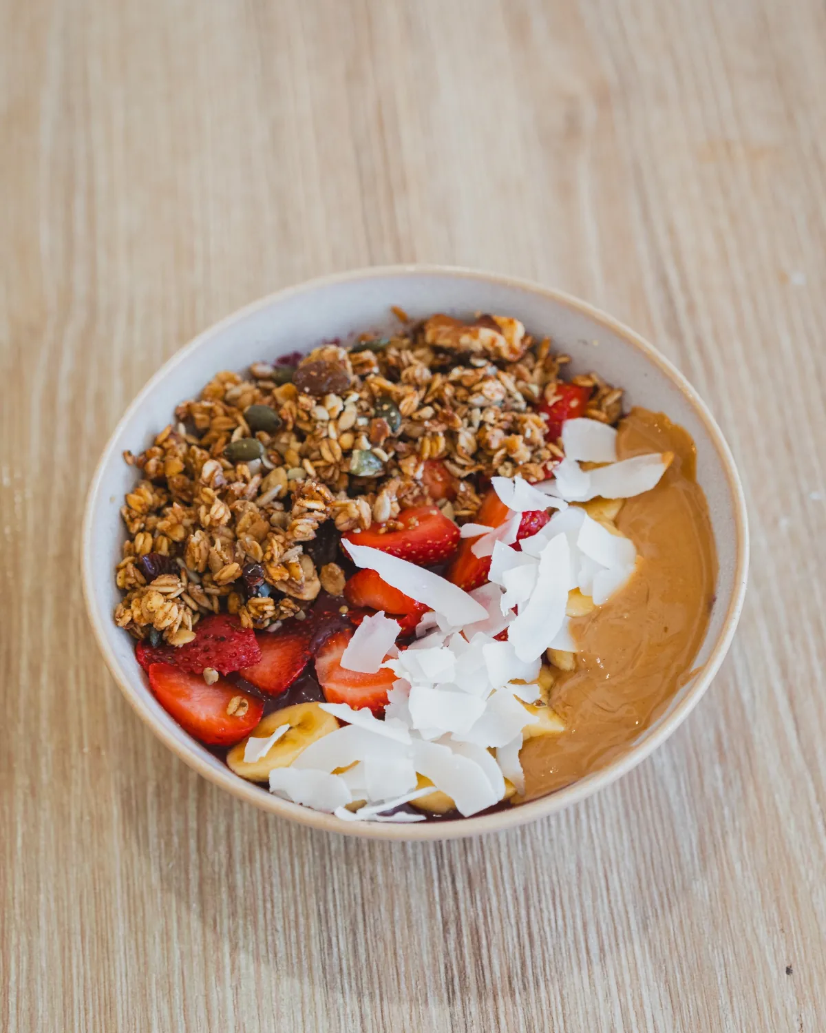 Homemade açaí bowl with fresh fruit and granola